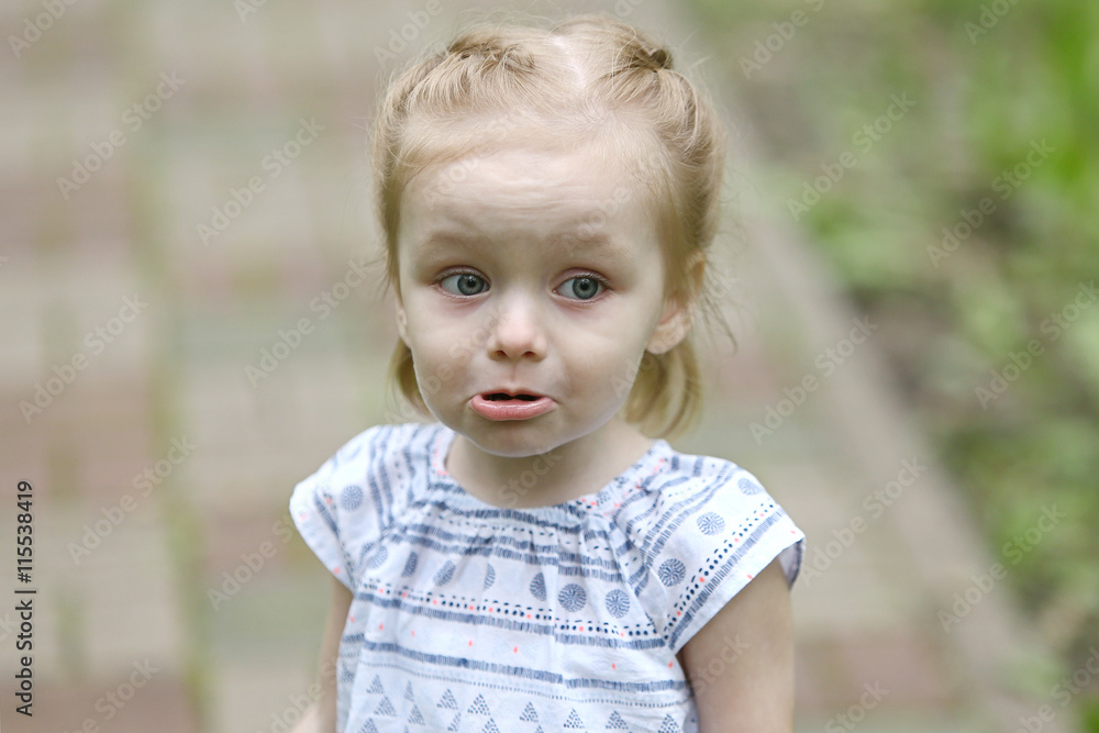 Sad little girl with a protruding lip Sad little girl with a protruding lip