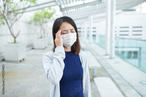 Woman suffer from sick and wearing face mask
