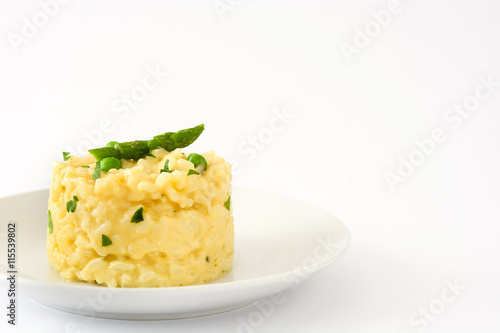 Risotto with peas, asparagus and parsley isolated on white background

