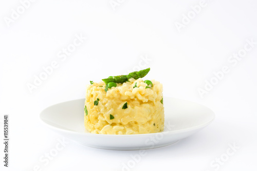 Risotto with peas, asparagus and parsley isolated on white background

