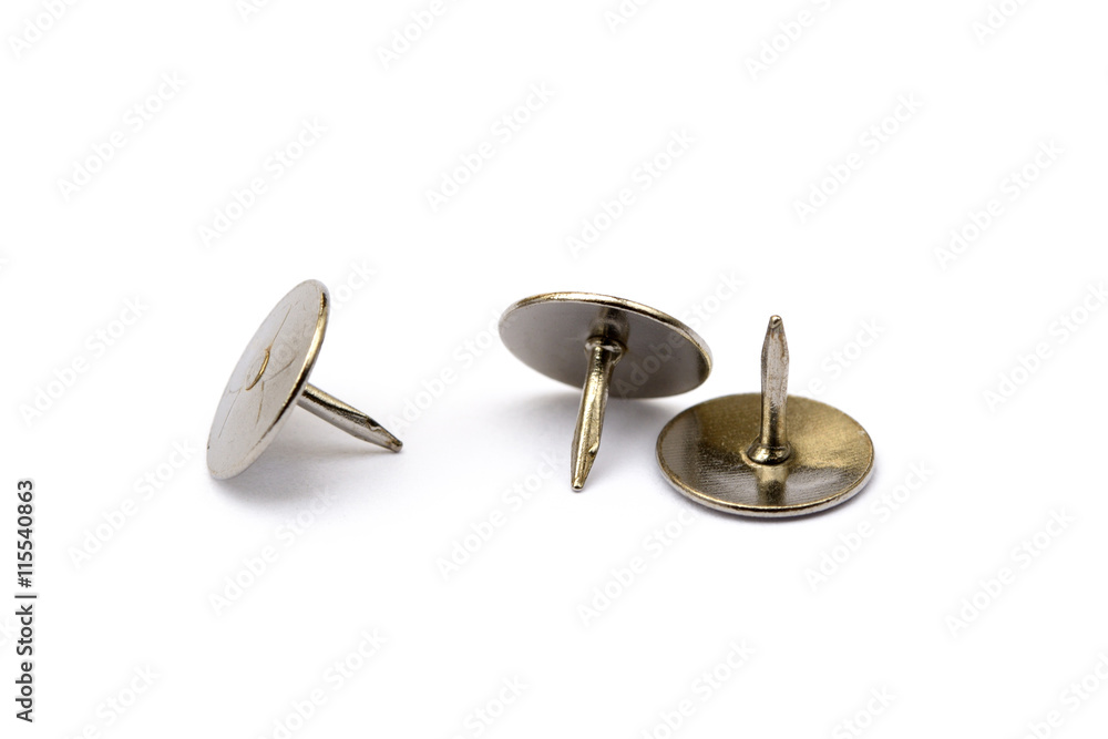 Ordered pile pushpins isolated on white background