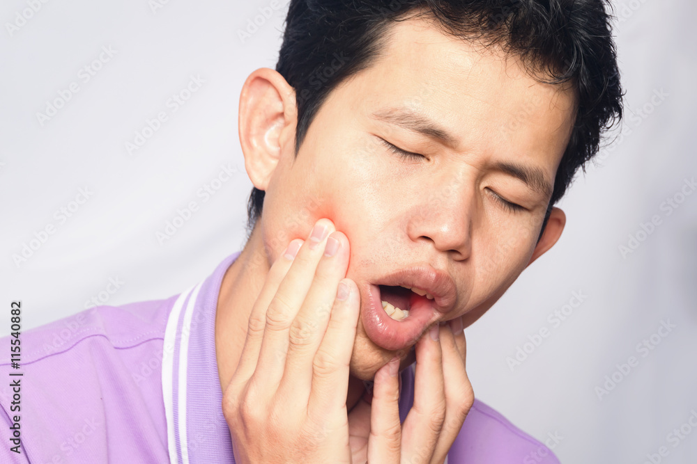 man have toothache on white background,symptoms of toothaches typically involve some kind of ache or pain in the jaws or gums man have toothache on white background,symptoms of toothaches typically involve some kind of ache or pain in the jaws or gums