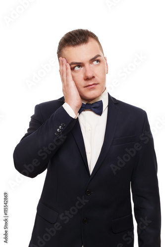 Young worried well-dressed man portrait isolated at white