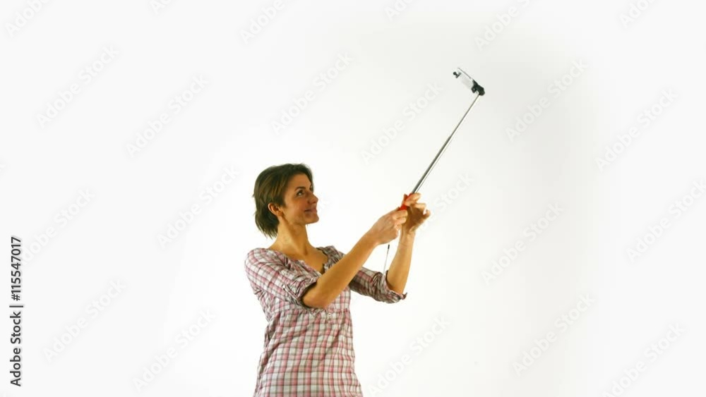 Pretty girl taking selfie with stick in ultra hd format Pretty girl taking selfie with stick in ultra hd format