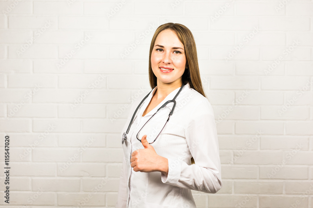 Portrait of cheerful doctor showing thumbs up gesture Portrait of cheerful doctor showing thumbs up gesture