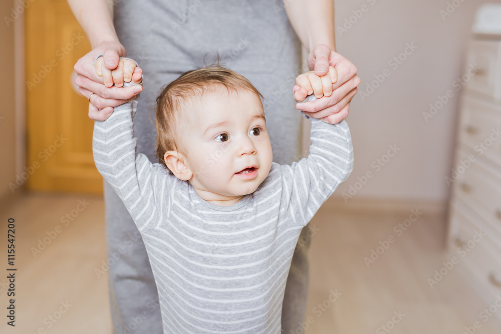 Fototapeta premium First steps of cute baby boy