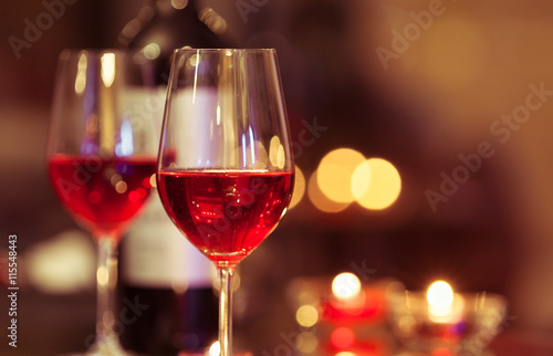 Closeup of wine glass in a restaurant setting. 