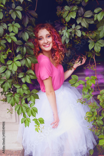 Happy smiling beautiful woman with curly hair photo