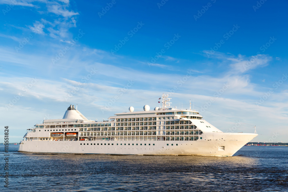 White cruise ship passes barrage gates Gulf of Finland