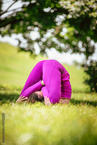 girl doing asana in park Yoga.