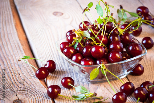 Fresh cherry on wooden table.