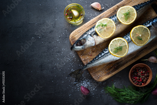 Raw mackerel on a dark background.