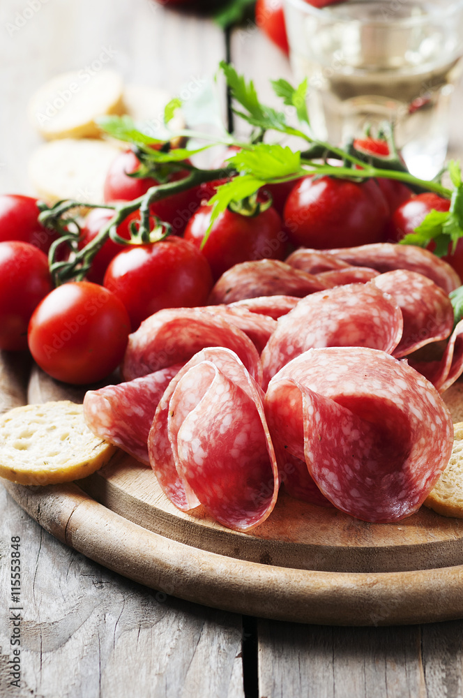 Fresh salami with tomato and bread