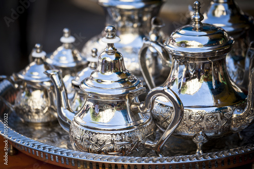 Table setting with silver tea or coffee cups