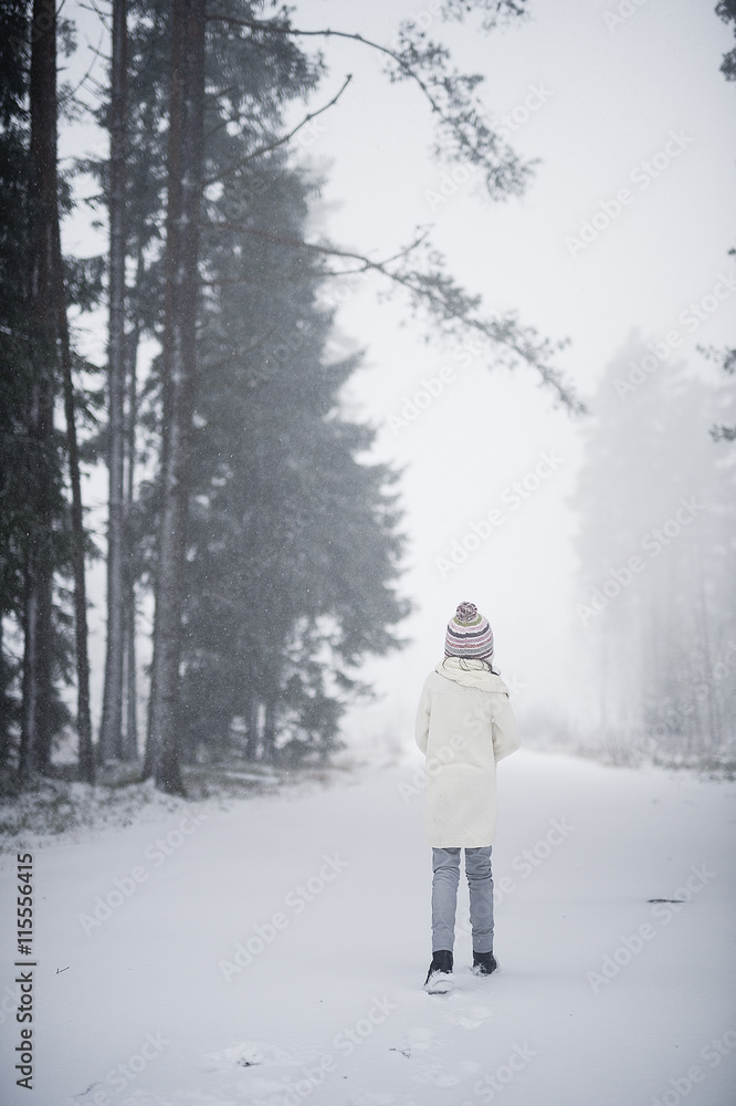 Sweden, Vastmanland, Bergslagen, Girl (8-9) in winter forest Sweden, Vastmanland, Bergslagen, Girl (8-9) in winter forest