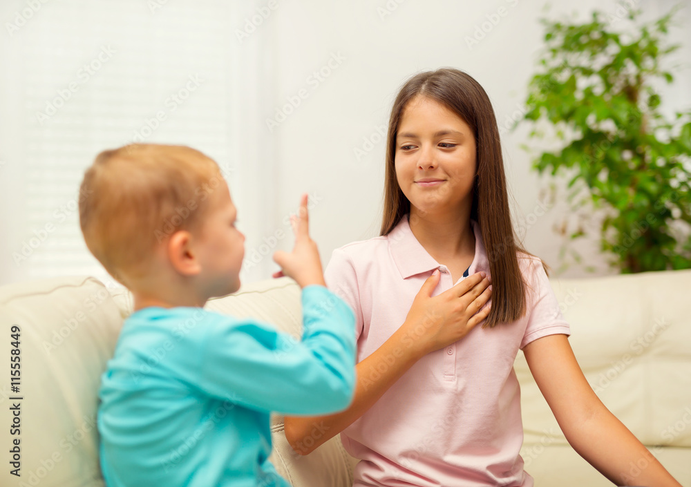 Brother and sister learn sign language at home Brother and sister learn sign language at home