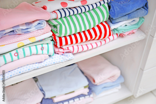 Clothes for kids on shelves