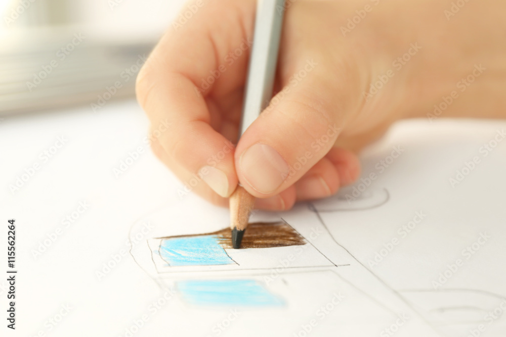 Child's hand drawing picture on paper Child's hand drawing picture on paper