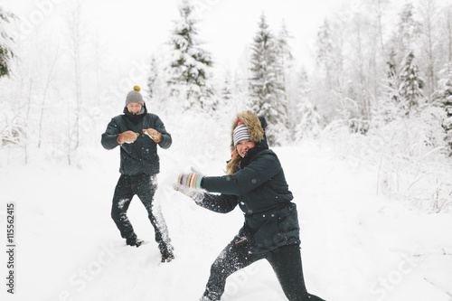 Finland, Jyvaskyla, Saakoski, Young couple having snowball fight