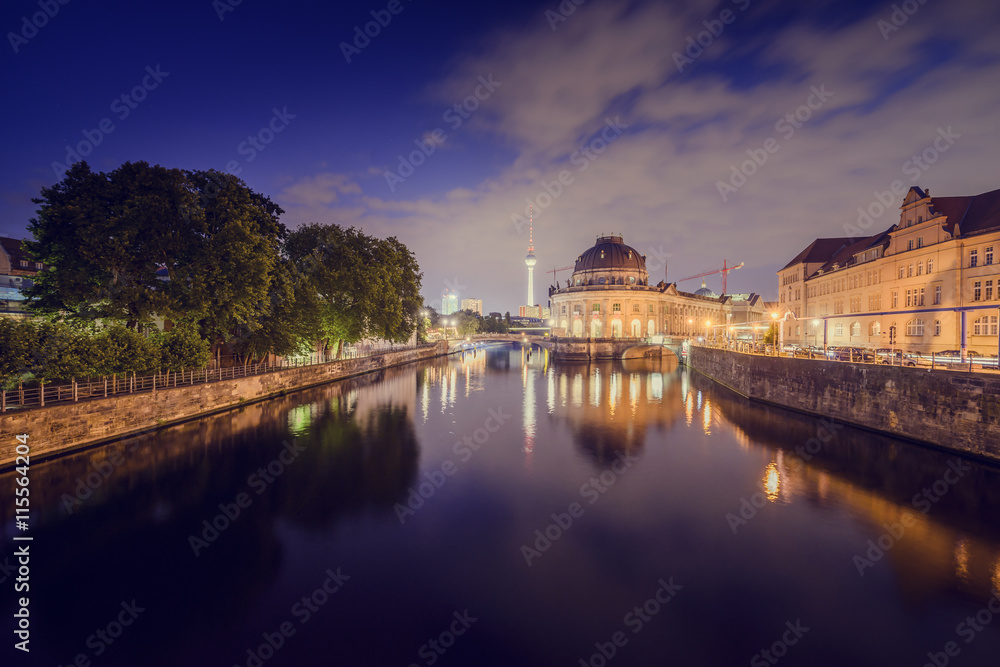 Germany, Berlin, Buildings reflecting in river at dusk Germany, Berlin, Buildings reflecting in river at dusk