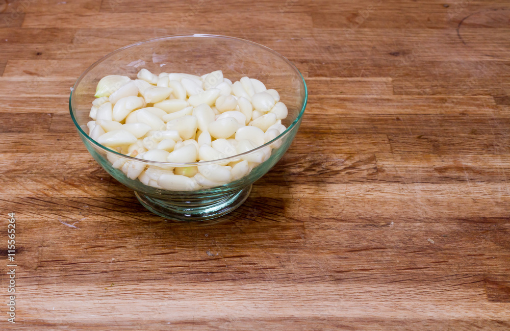 Bowl of peeled garlic cloves Bowl of peeled garlic cloves