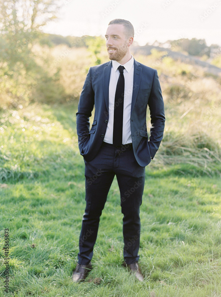 Sweden, Groom standing with hands in pockets Sweden, Groom standing with hands in pockets