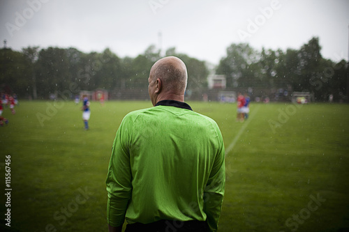 Sweden, Referee standing on soccer field photo
