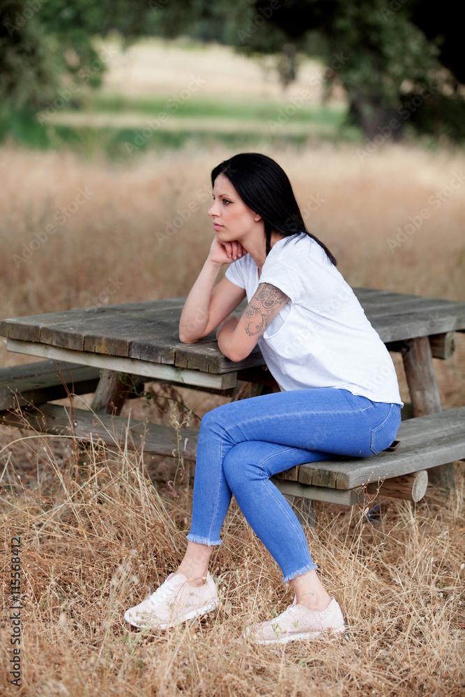 Fototapeta premium Relaxed cool girl in a beautiful park