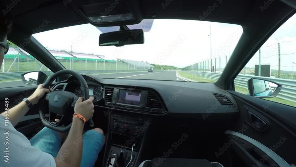 Racer starts driving the race on car track Racer starts driving the race on car track