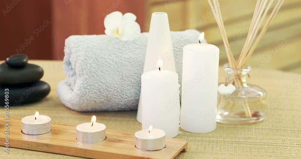 Oil, towel, candles and stones at spa Oil, towel, candles and stones at spa