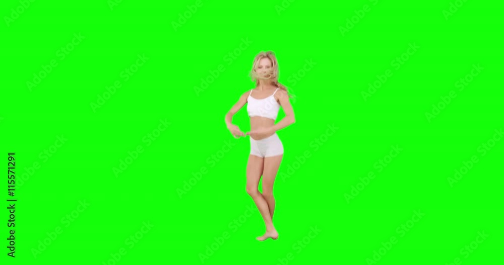 Pretty blonde doing ballet dancing on green screen background Pretty blonde doing ballet dancing on green screen background