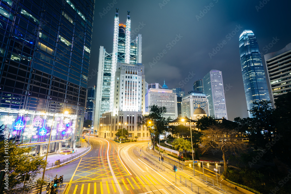 Fototapeta premium Long exposure of an intersection and modern skyscrapers at night