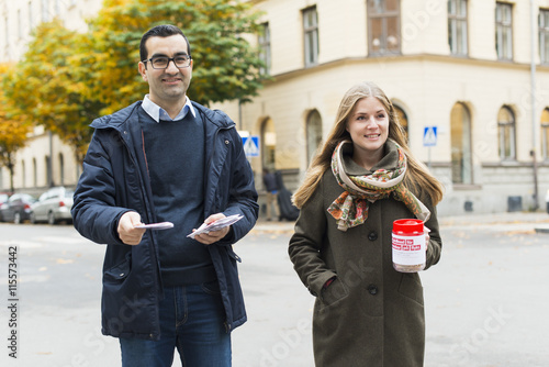 Sweden, Sodermanland, Stockholm, Sodermalm, Portrait of charity volunteers on street photo