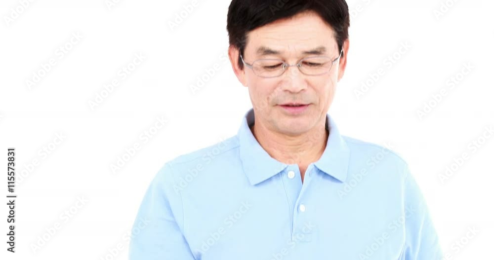 Middle-age man having a phone call on white screen Middle-age man having a phone call on white screen