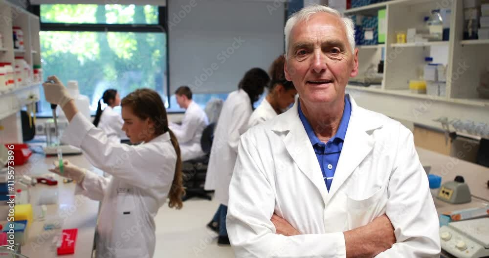 Science professor smiling at camera in class in high quality 4k format Science professor smiling at camera in class in high quality 4k format