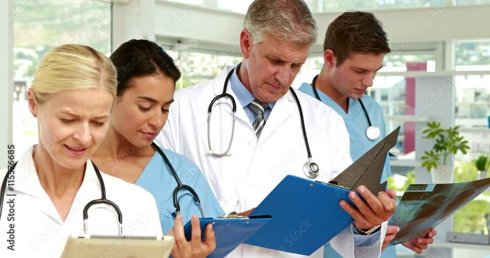 Serious medical team working in medical office Serious medical team working in medical office