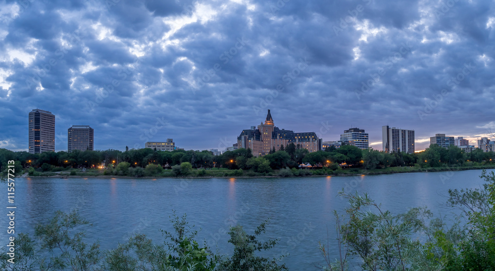 Saskatoon skyline at night along the Saskatchewan River.