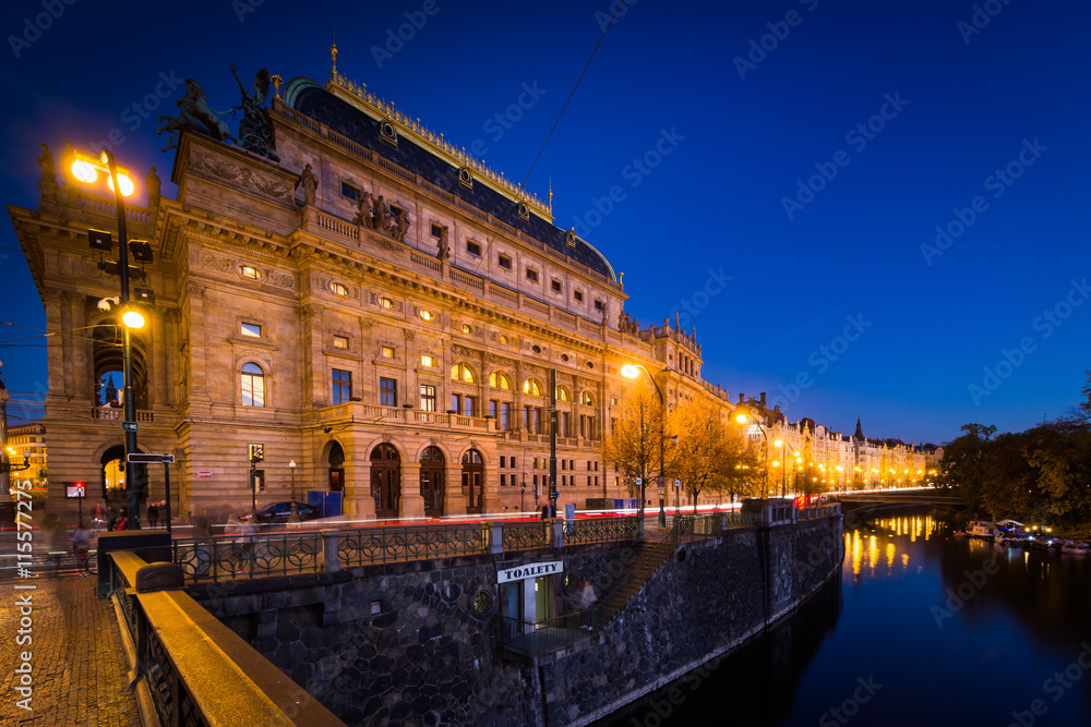 Fototapeta premium The Legion Bridge and buildings along the Vltava at twilight, in