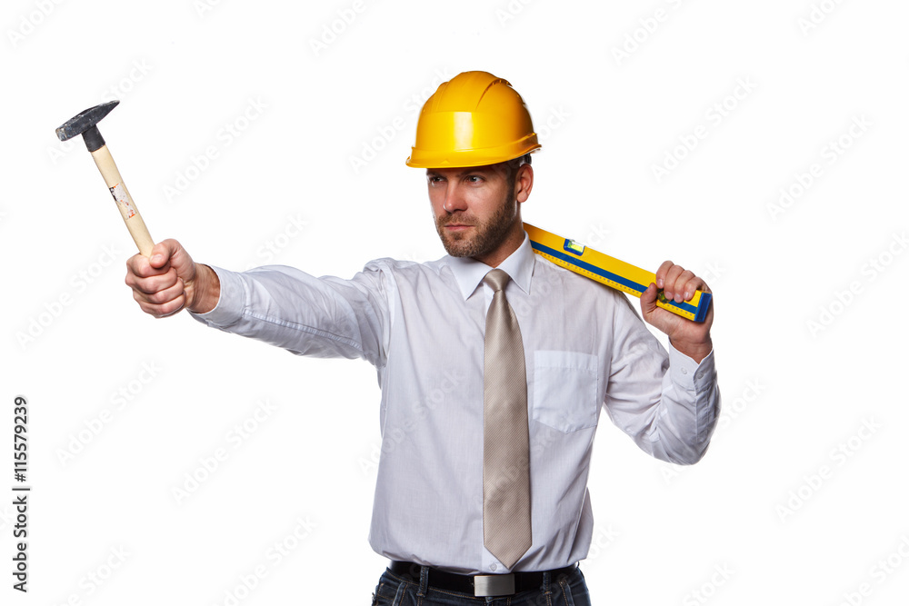 A man holding hummer and level. A man holding hummer and level.