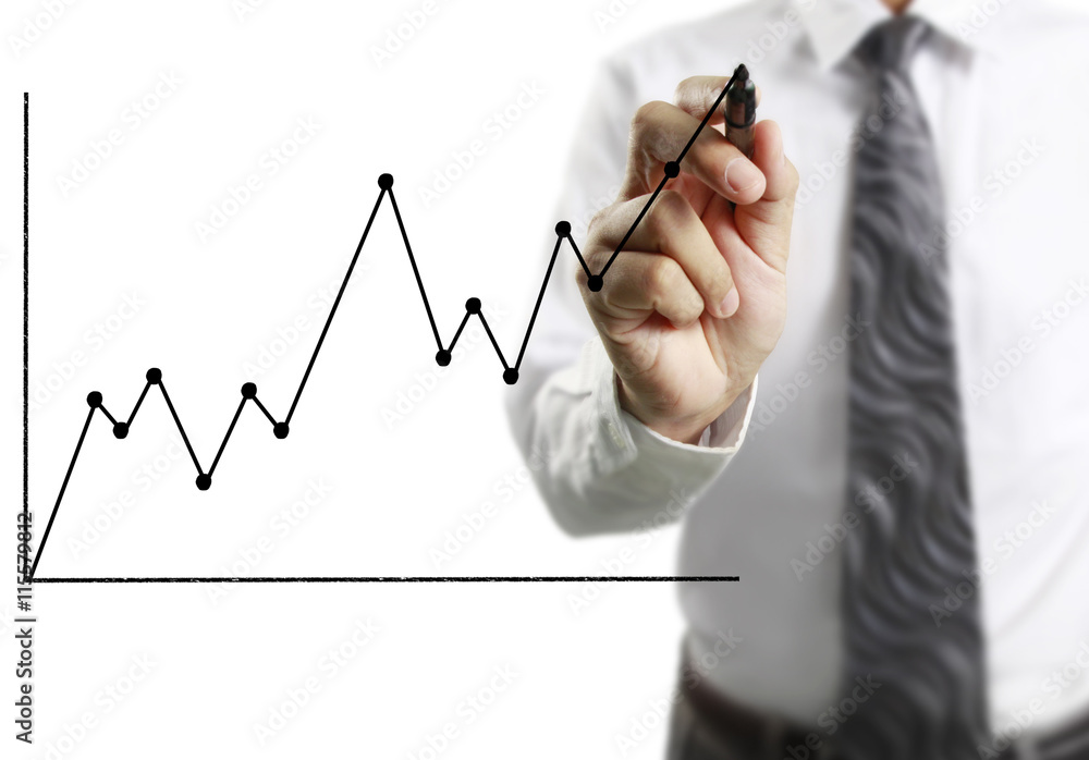Businessman drawing graphics growing graph Businessman drawing graphics growing graph