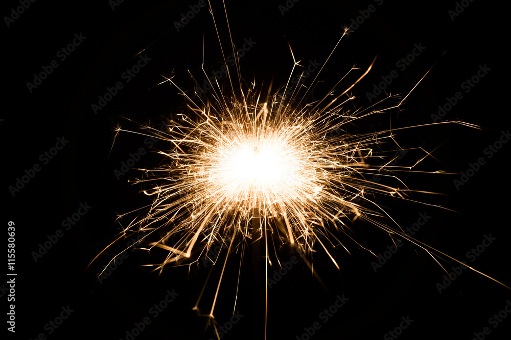 Sparkler on black background for Christmas or new year party, close-up