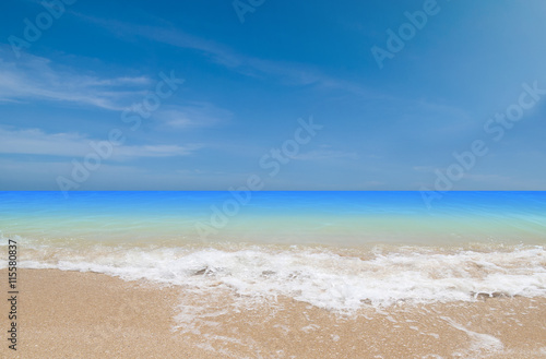 Wave & Sand beach with blue sky background