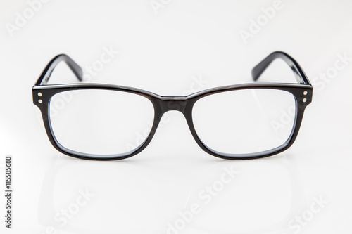 Retro style black eyeglasses on a white background.