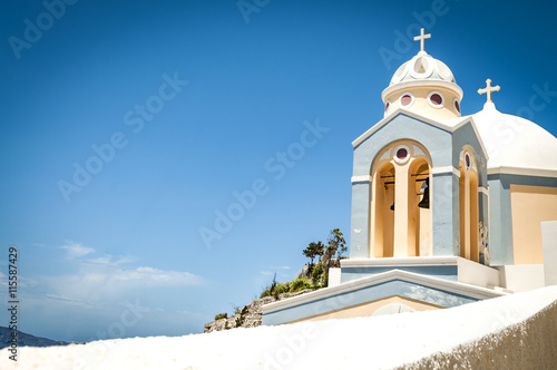 Church bells of a Greek Orthodox Church overlooking the Aegean Sea in the town of Oia on the island of Santorini in the Cyclades off the coast of Greece