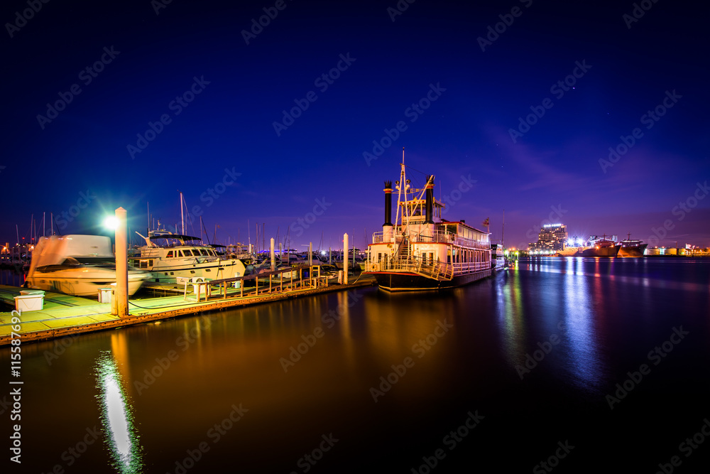 Boats on the waterfront at night, in Canton, Baltimore, Maryland