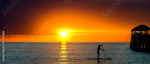 Paddle surfing man