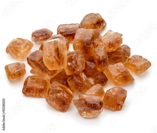 Brown caramelized lump cane sugar cube isolated on white backgro