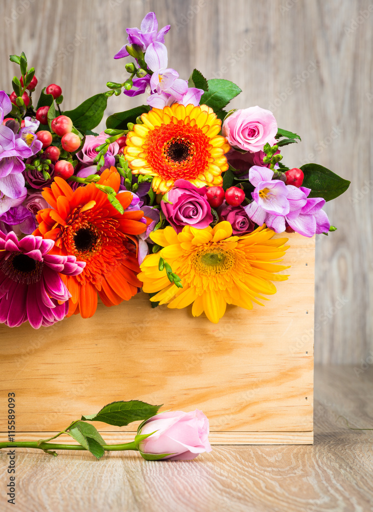 Mixed beautiful flowers on wooden background
Mixed beautiful flowers on wooden background
