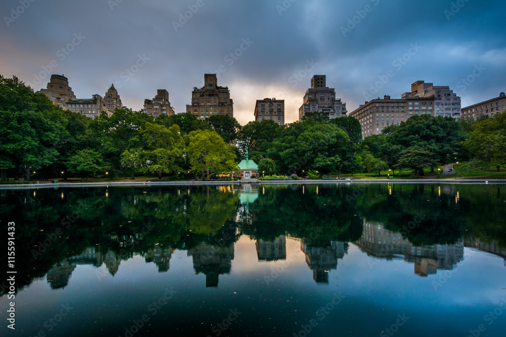 Buildings reflecting in the Conservatory Water in Central Park,