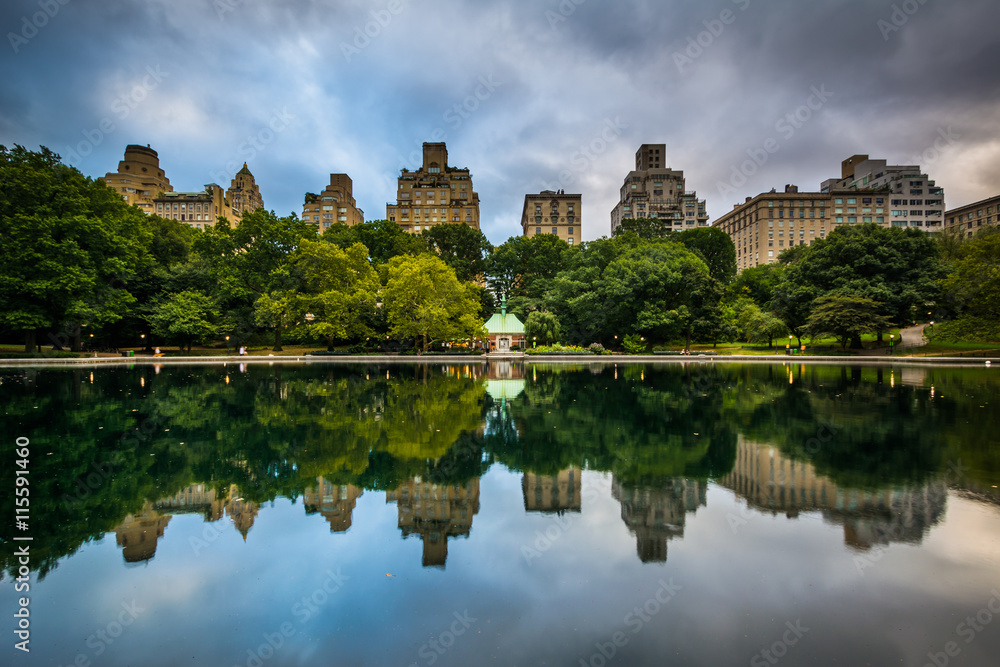 Buildings reflecting in the Conservatory Water in Central Park,